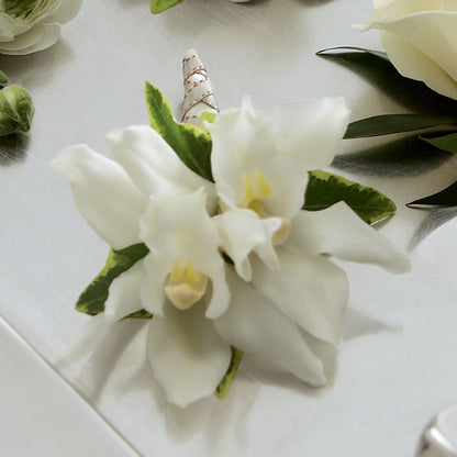 White Mini Cymbidium Boutonniere –  Imperial Flower Shop Ltd, Brampton ON